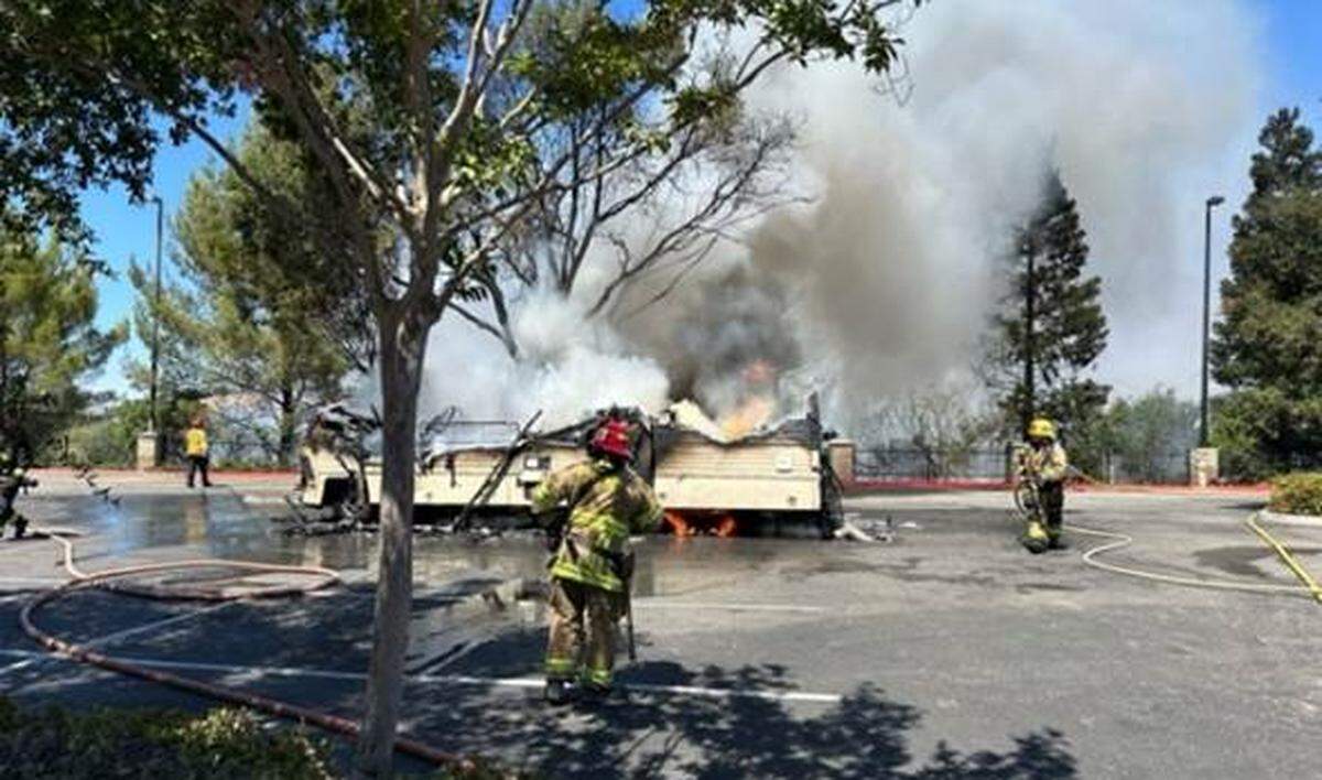 A motor home caught fire in the Home Depot parking lot in Atascadero on Sunday afternoon Aug. 11, 2024, spreading flames a quarter of a mile into surrounding vegetation and requiring backup to put out the flames.