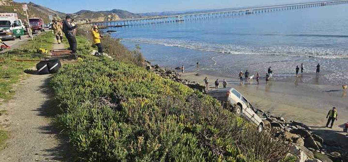 A car collided with another vehicle before crashing off of Avila Beach Drive onto Olde Port Beach below Wednesday, Jan. 1, 2025.