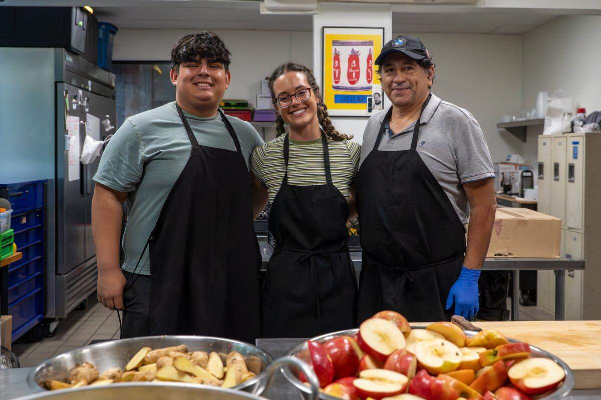 SLO Pressed kitchen manager Iker Ponce, owner Briana Medvecki and juicer Alberto Hernandez pose for a photo in the CaliPaso kitchen in San Luis Obispo on Thursday, May 14, 2026. Medvecki started pressing juice in 2025 as a way to treat acne and other skin irritations.