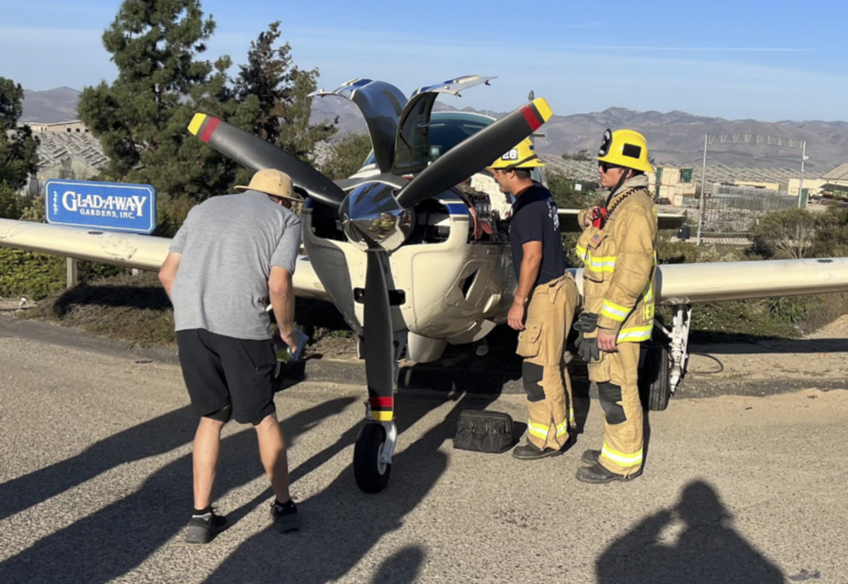 Officials investigate the scene of a plane crash on Saturday, Oct. 29, 2022, east of Orcutt.