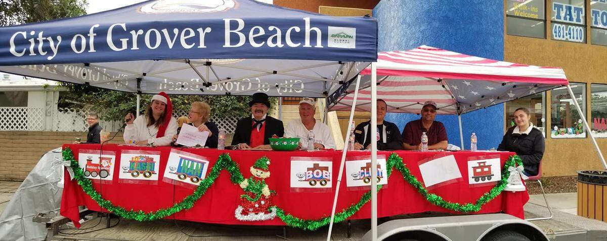 The South County Holiday Parade features an annual competition for entries; above, the judges sit and watch — including resident Grover Cox as city founder D.W. Grover.