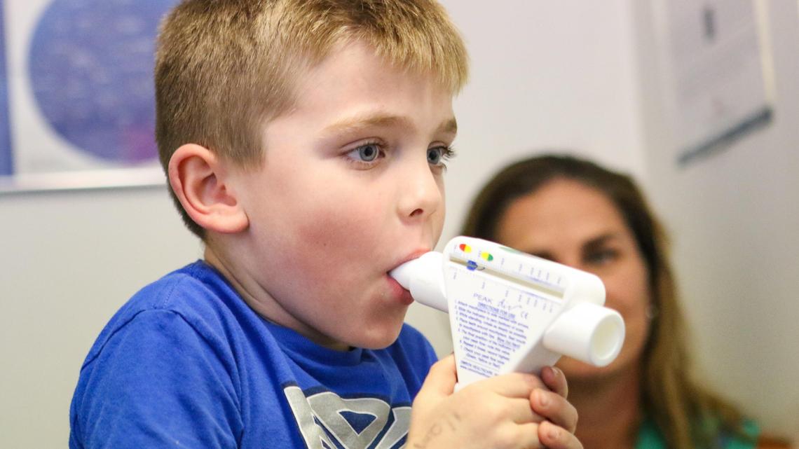 Gwynne Stump watches as her son Kagan tests his lung strength. He is being treated for asthma by Dr. William Morgan, a pediatrician in Arroyo Grande. The Nipomo family is concerned about particulate pollution in the area.