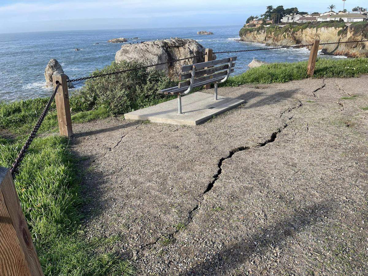 Large cracks in the ground near a cliffside at Margo Dodd Park in Pismo Beach.