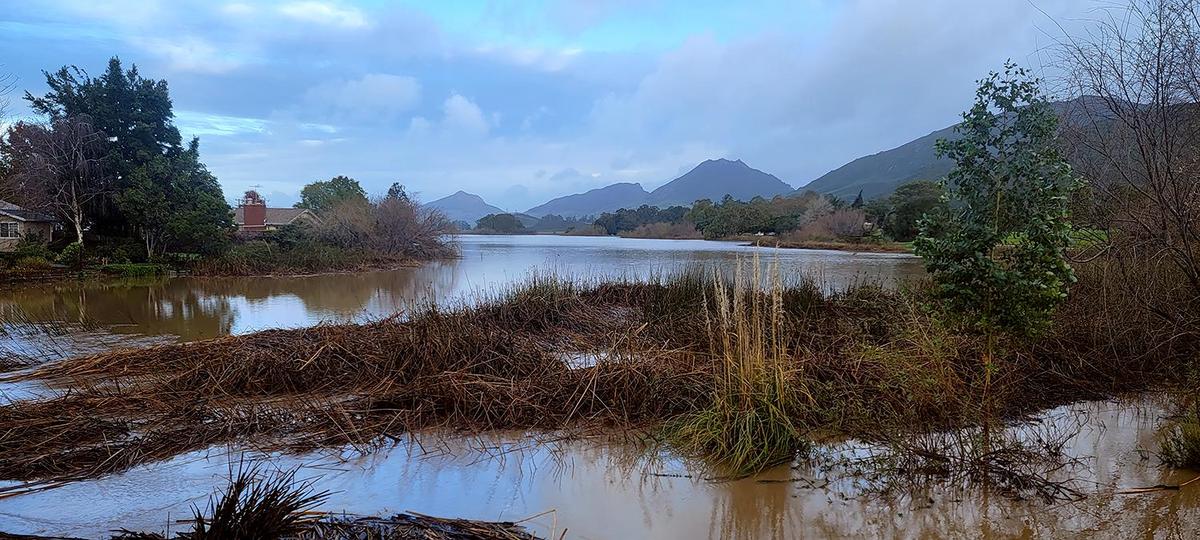Laguna Lake in San Luis Obispo receded a little but was still swollen with floodwater on Tuesday, Jan. 10, 2023.