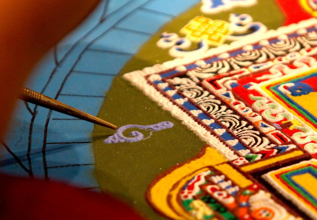 Tibetan monks from India began to build a sand mandala at the Aligned Acupuncture and Wellness Spa in San Luis Obispo on Sept. 24, 2024. They will destroy the mandala on Sept. 27, 2024.