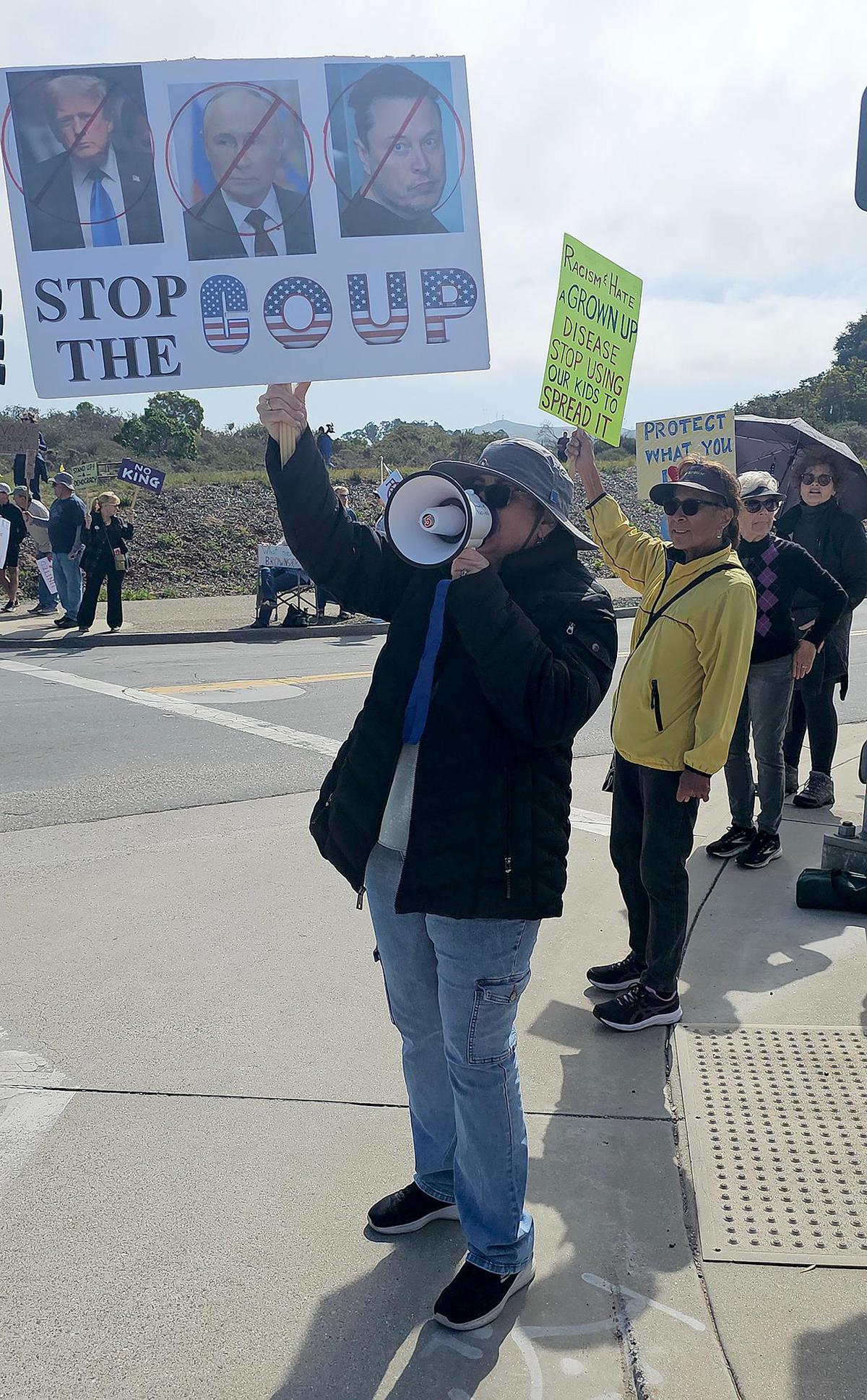 Hundreds of people gathered at each corner of the intersection at Los Osos Valley Road and South Bay Boulevard to protest the current administration on Saturday, Mar. 1, 2025.