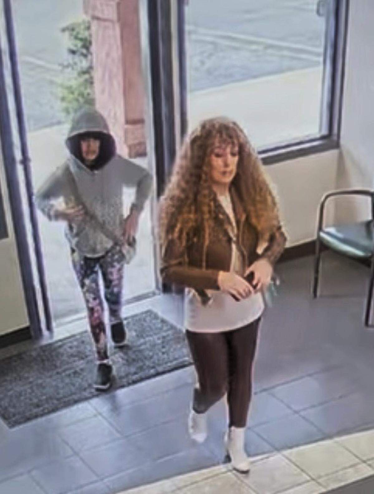Melodee Buzzard, left, and her mother, Ashlee Buzzard, appearing to wear wigs inside a car rental shop in Lompoc on Oct. 7 before embarking on a roadtrip to Nebraska. The Santa Barbara Sheriff’s Office said 9-year-old Melodee did not return from the roadtrip.