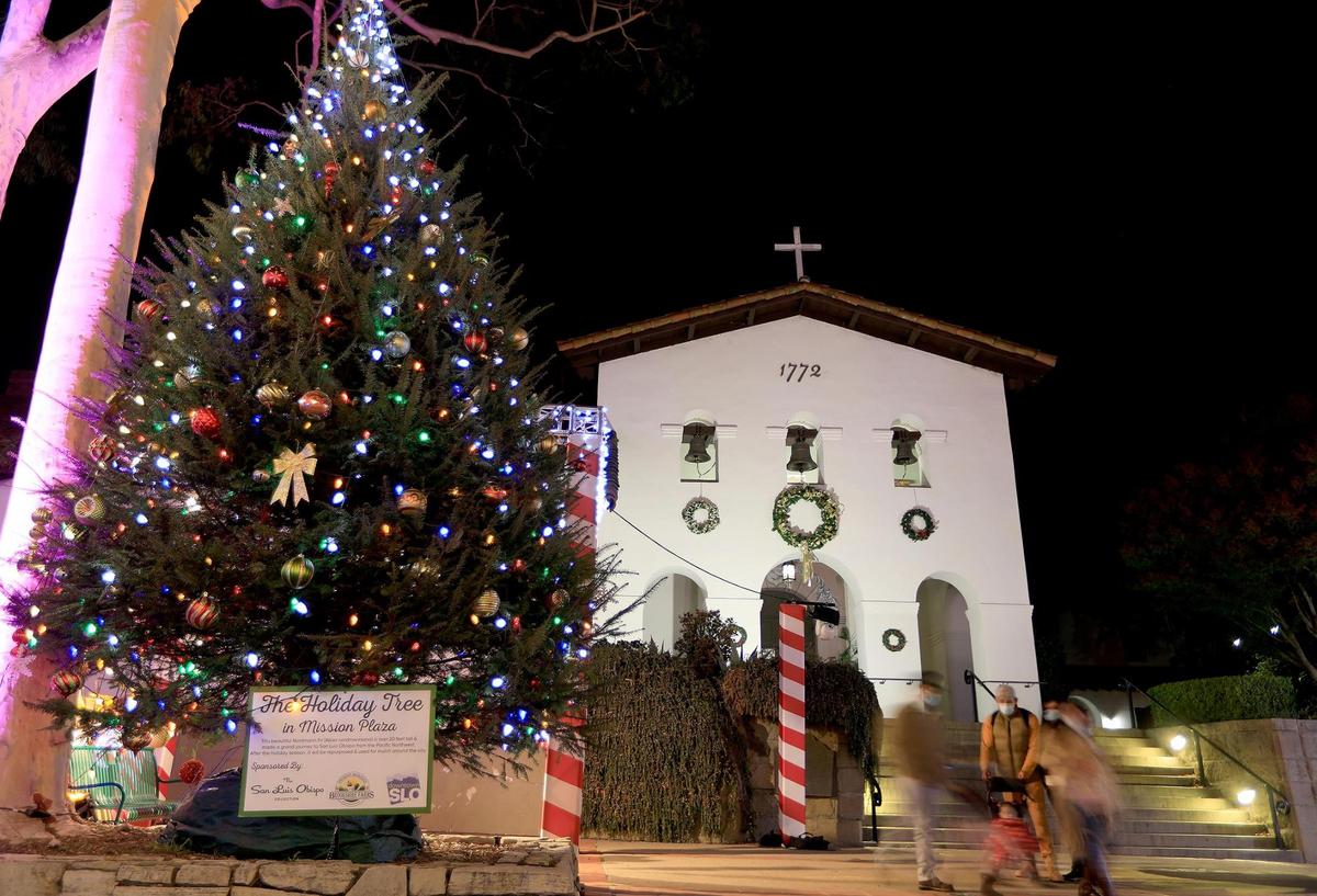 A Christmas tree stands in Mission Plaza in front of Mission San Luis Obispo de Tolosa. San Luis Obispo’s Light Up Downtown event is happening through Jan. 10, 2021.