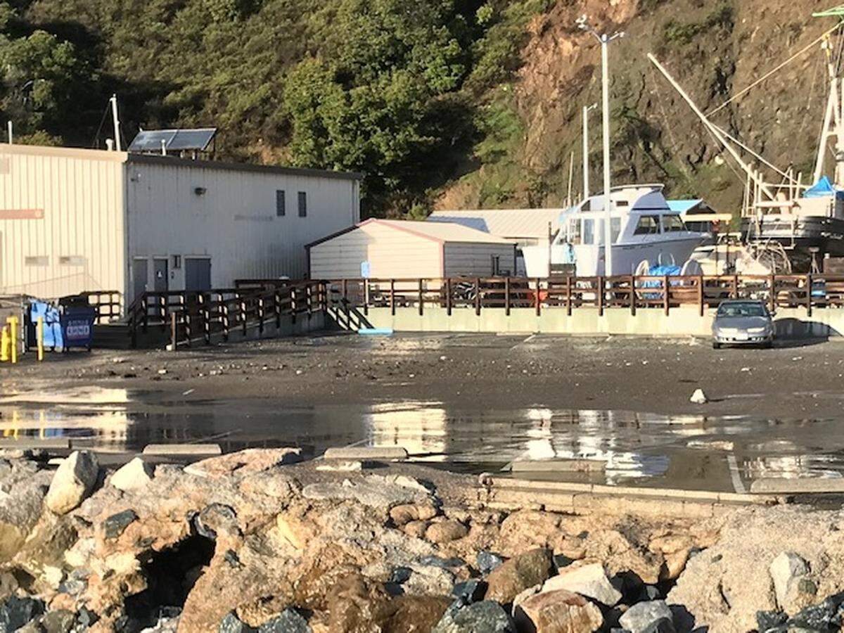 Rocks and debris can be seen in the westernmost parking area of Port San Luis, next to the boatyard, on Monday. The Port San Luis Harbor District closed the parking area after finding a large boulder there on Monday morning.