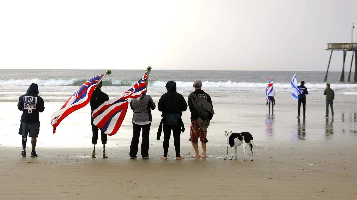 Supporters gather to the watch the 2022 Pismo Beach ISA World Para Surfing Championships, hosted by AmpSurf, and cheer on the surfers.
