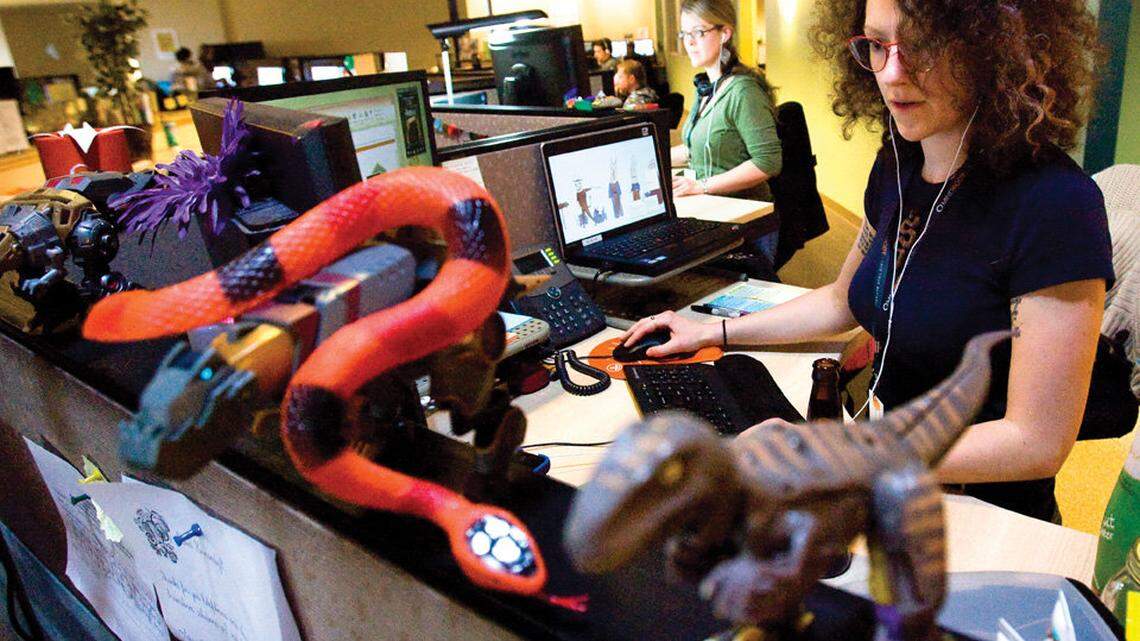 Ash Rexford, front, and Sharelle Harms work in the introduction team helping new users with the software.