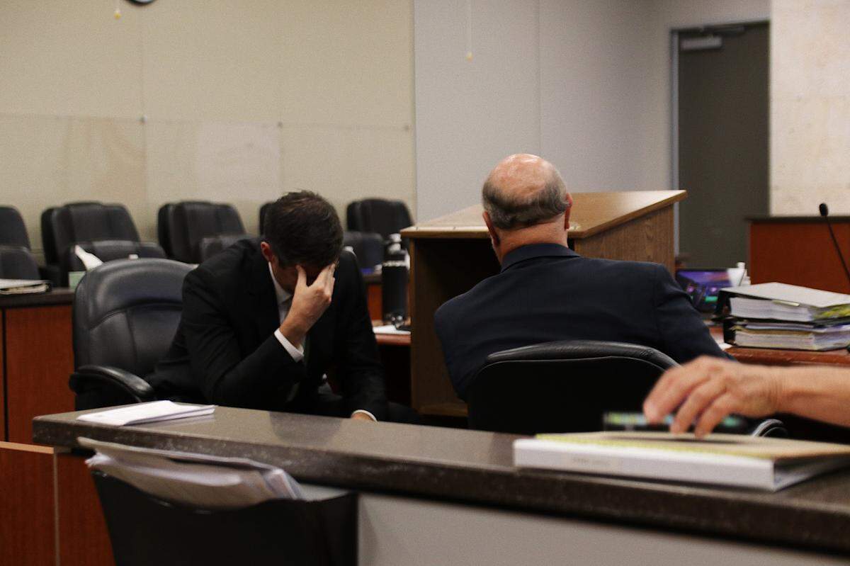 San Luis Obispo County Deputy Ditrict Attorney Chris Peuvrelle, left, speaks with defense attorney Robert Sanger in Monterey County Superior Court in Salinas on Sept. 26, 2022. Sanger’s client, Paul Flores, is on trial for the 1996 murder of Kristin Smart.