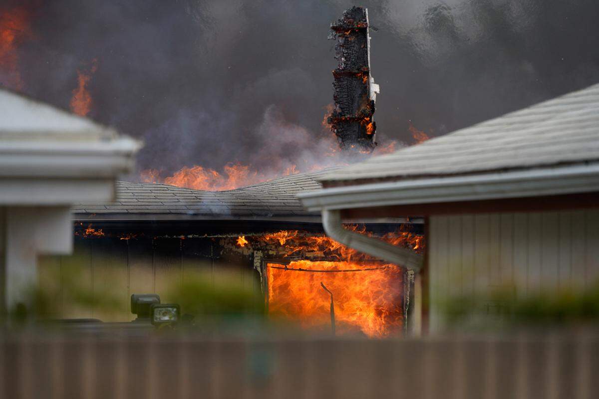 Flames are seen at a mobile home burning on West Taylor Street in Santa Maria on Friday, June 21, 2019. Police say two people were found dead at Casa Grande Mobile Estates.