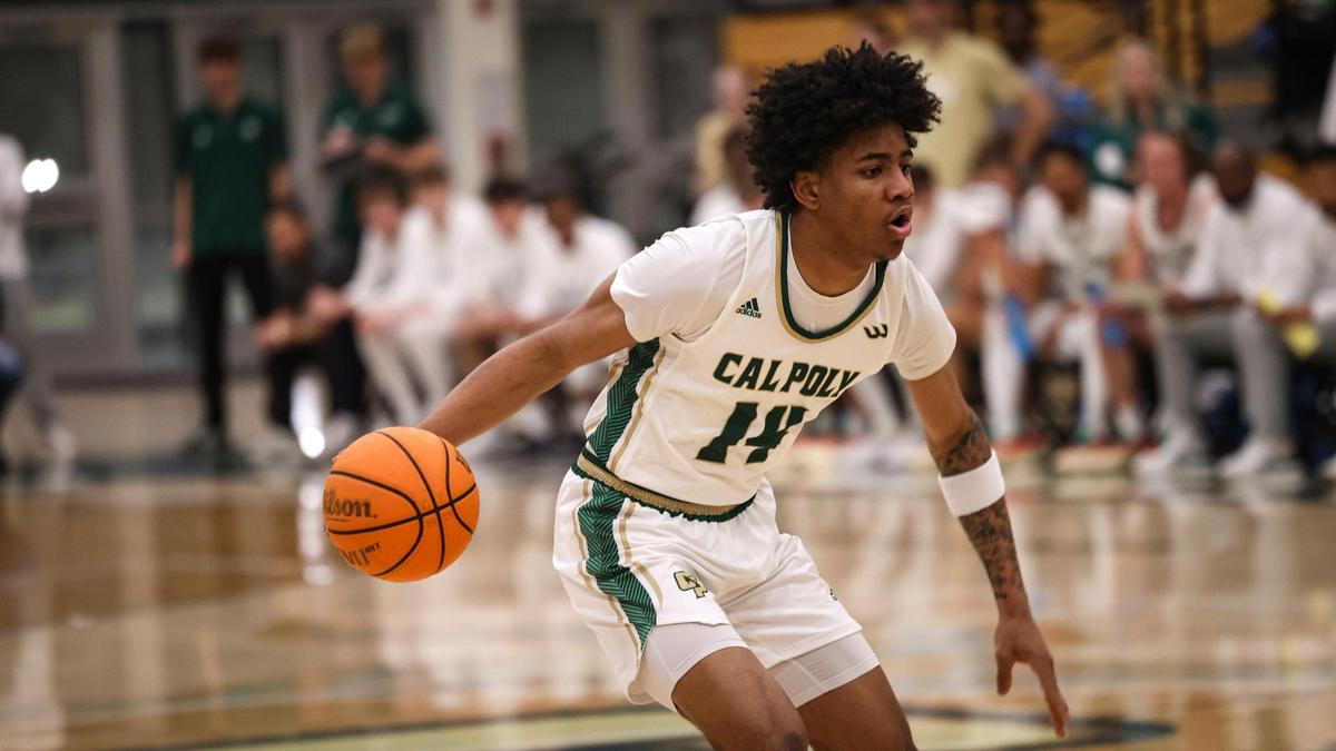 Cayden Ward looks for an opening for a pass or a drive to the rim. Cal Poly lost to UCSD 81-67 in a basketball game on Feb. 20, 2025.