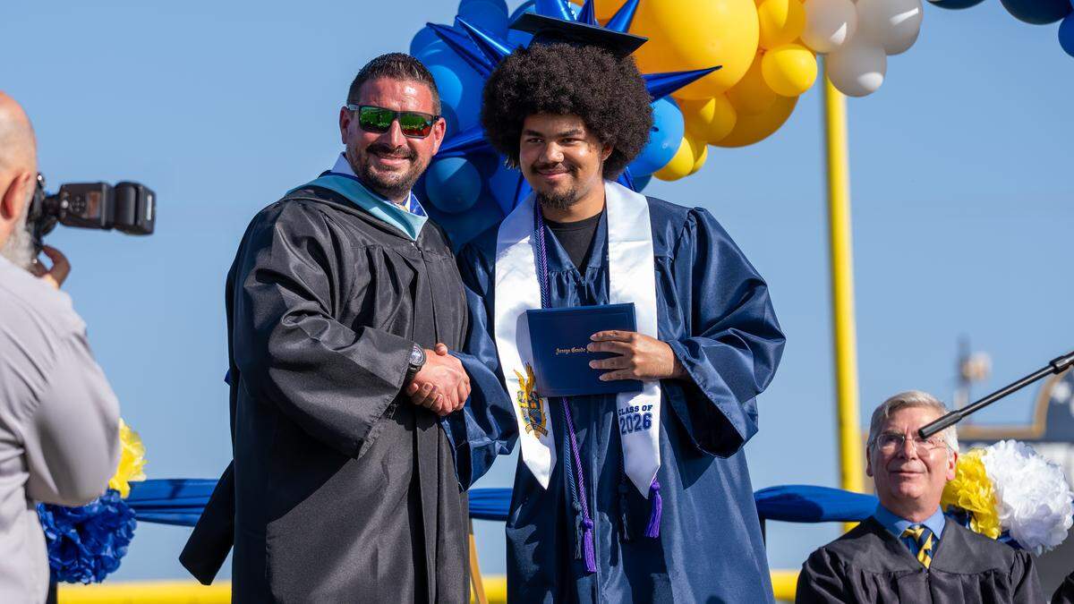 Arroyo Grande High School graduate Tru Holmes receives a diploma during graduation ceremonies on Thursday, June 4, 2026. A class of 443 seniors walked the stage at Doug Hitchen Stadium.