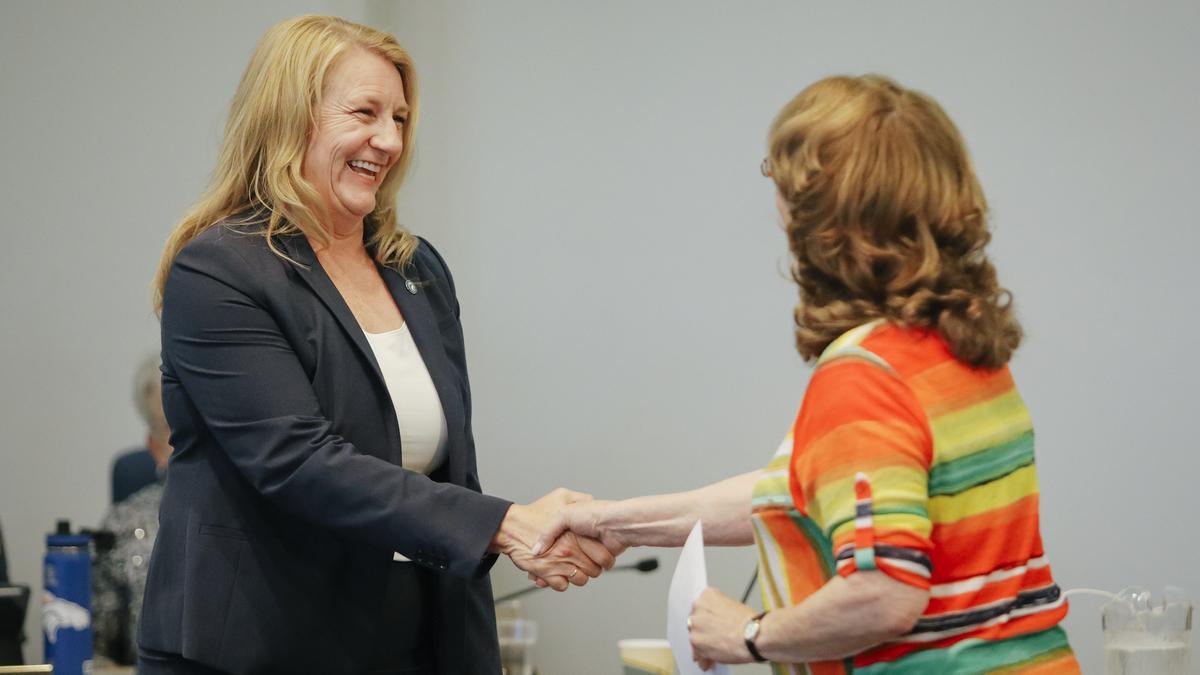 Cuesta College President Jill Stearns is sworn in by Chair of the Board of Trustees Dr. Barbara George during the board's monthly meeting Wednesday, July 11, 2018, in San Luis Obispo, California.