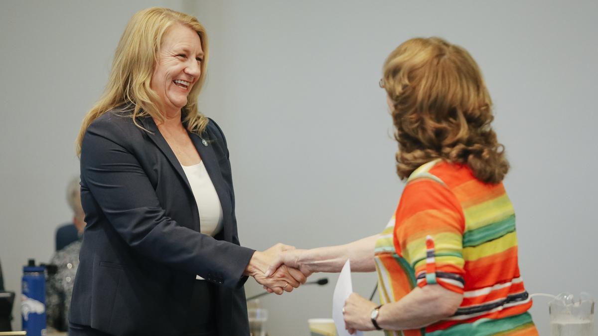 Cuesta College President Jill Stearns is sworn in by Chair of the Board of Trustees Dr. Barbara George during the board's monthly meeting Wednesday, July 11, 2018, in San Luis Obispo, California.