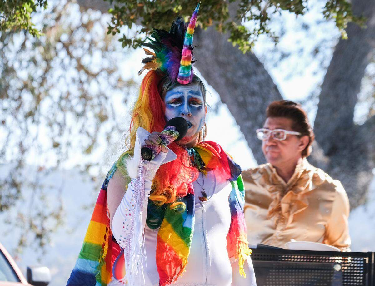 Katie Peña sings Chappell Roan’s “Pink Pony Club” during karaoke at the memorial for Todd Pinion in Santa Margarita on Nov. 9, 2024. Pinion was killed in an alleged hate crime on Oct. 23, 2024.