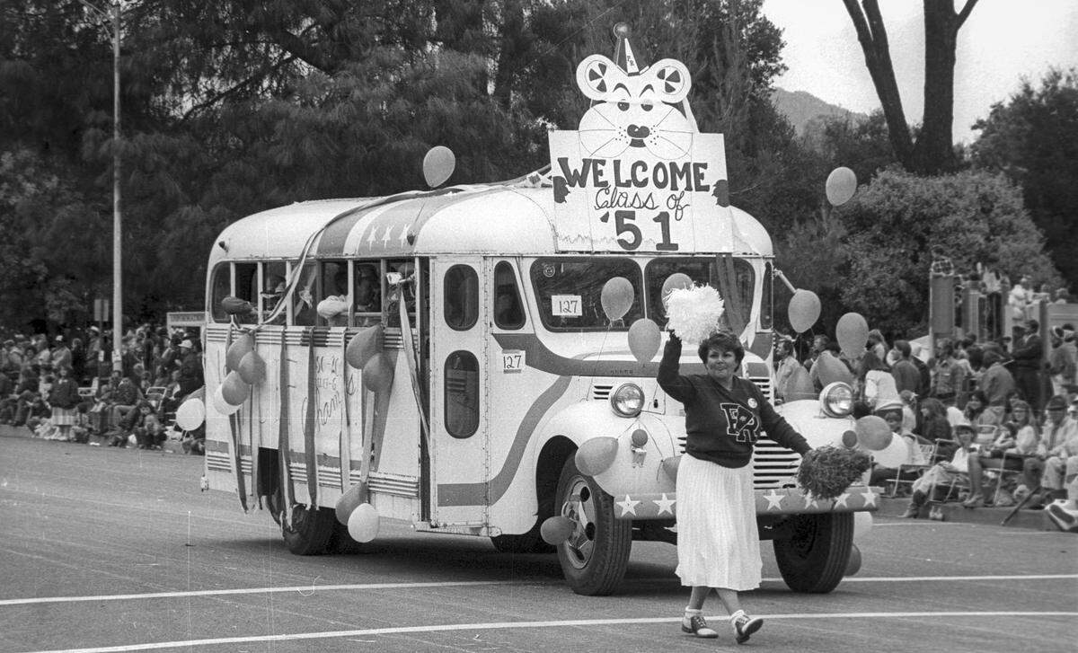 Norma Moye as a cheerleader in front of the bus representing the Paso Robles Class of 1951 at the Pioneer Day parade on Oct. 11, 1986.