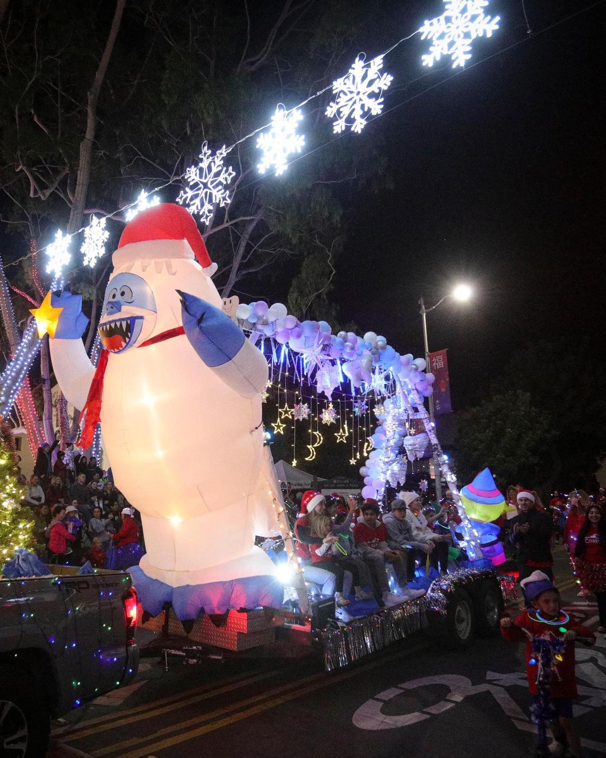 Coastal Pediatric Dentistry had a yeti on their float. Unseasonably warm weather encouraged a large crowd to attend the 48th annual downtown Holiday Parade. on Dec. 6, 2024.