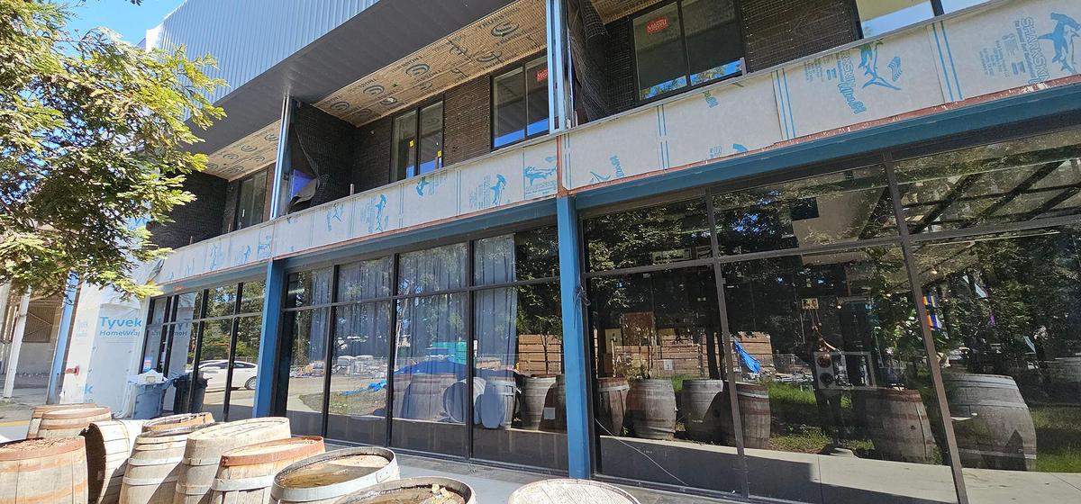 Exposed wrapping material can be seen on the rear and west side of the building at 1150 Laurel Lane in San Luis Obispo in March 2025. The tenants, including Bang the Drum brewery and SLO City Church, have been told they have to vacate the property due to unsafe construction conditions.