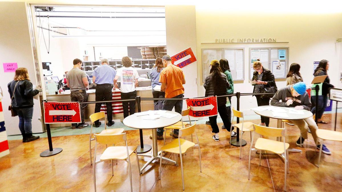 Voters line up Tuesday during the last hour of voting at the Clerk-Recorder’s Office in San Luis Obispo.