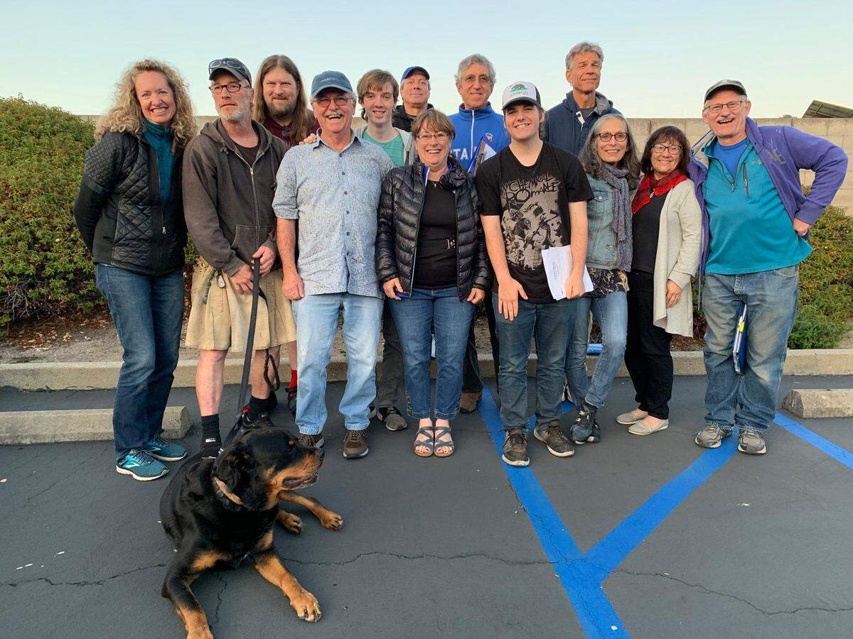 Cast of the 2019 Pinedorado Follies in Cambria. Back row, left to right: Rick Bruce, Caden Linn, Michael Shanley, Joel Cehn, Kirk Henning. Front row: Diana Lindsey, Tim Lindsey, John Linn, Renee Linn, Treiy Pettit, Lucy Moreno, Rebecca Hendricks, Ted Key. Foreground: Mozz E. Rotti (he is part of the show).