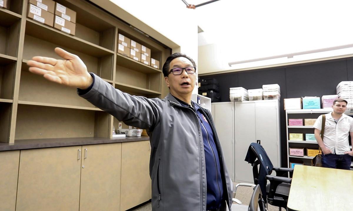 San Luis Obispo County clerk recorder Tommy Gong explains the use of a secure, plexiglass protected area of a ballot production room to a group on a tour of the facility. The county clerk-recorder’s office is preparing for Election Day on Nov. 3, 2020.