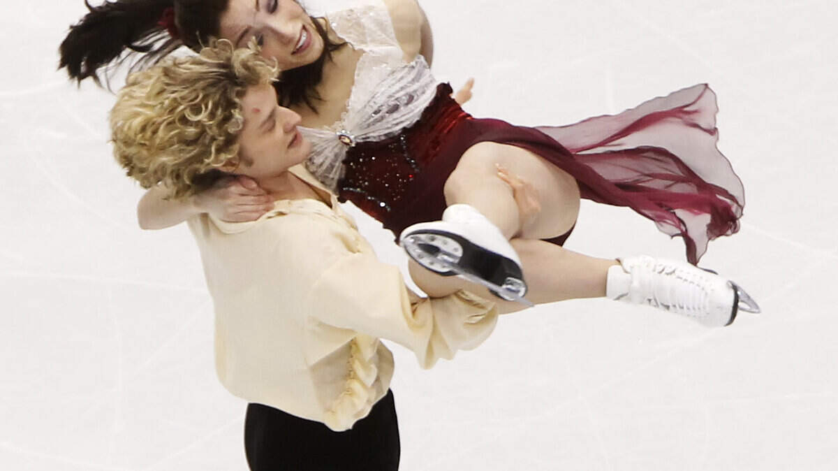 Meryl Davis and Charlie White of the United States compete in ice dancing. (George Bridges / MCT)