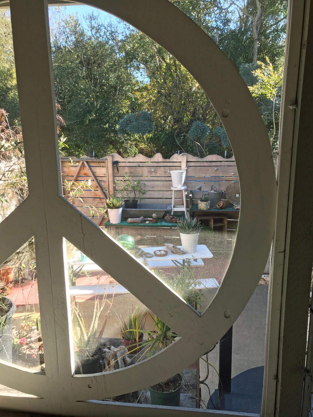 Sea + Green shop owners Becky Biskaduros and Jay Turton created a peace window view of a relaxing garden area behind their store at 2380 Main St. in Cambria.
