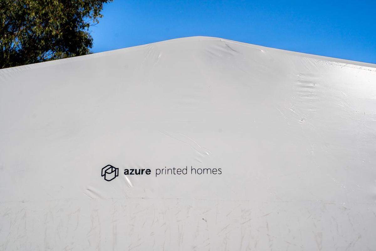 Azure Printed Homes provided the tiny home units for the Welcome Home Village, seen here under plastic wrap on Friday, Nov. 21, 2025. The homes were produced at a facility in Gardena and shipped to San Luis Obispo in late 2025.