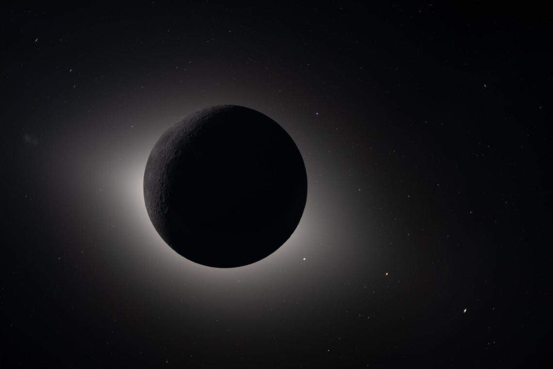 Captured by the Artemis II crew during their lunar flyby on April 6, 2026, this image shows the moon fully eclipsing the sun.