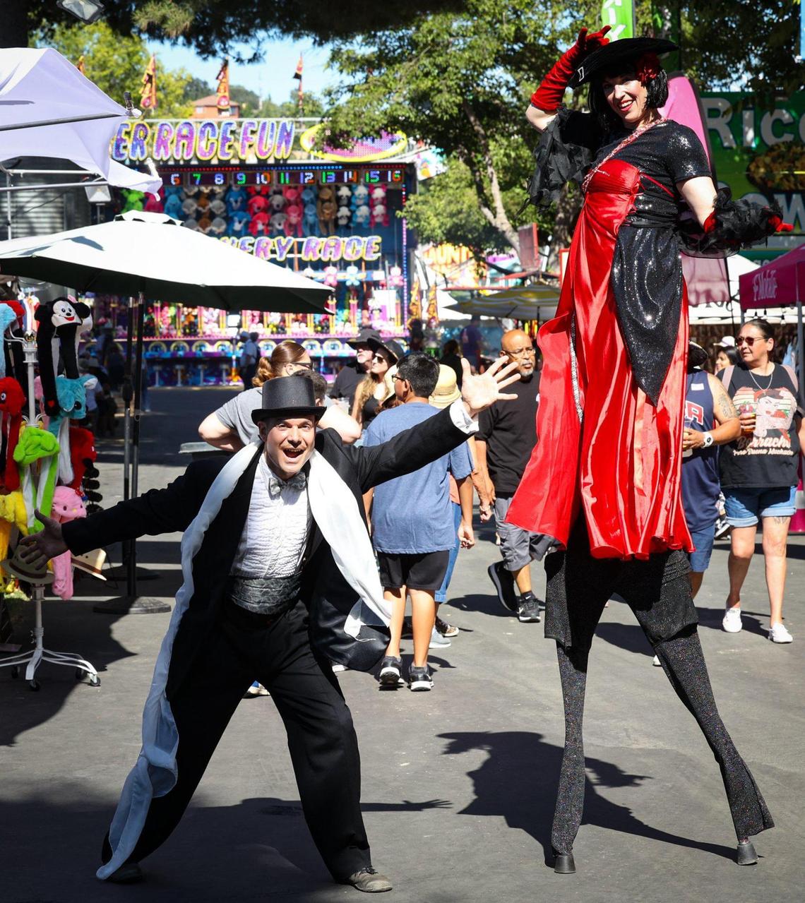 Bradley Holzer and Kasey Cutting are part of Dragon Knights, a stilt walking group that can be seen at the California Mid-State Fair, which opened Wednesday, July 19, 2023, in Paso Robles.