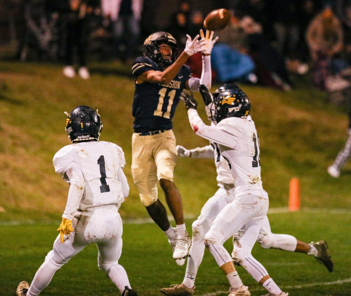 Jamar Howard leaps above three defenders to catch a touchdown pass. Mission Prep beat Arroyo Grande 35-14 in second-round CIF Central Section football playoff game on Nov. 10, 2022.
