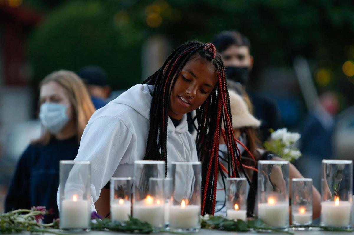 San Luis Obispo County residents gather at Mitchell Park in San Luis Obispo for a candlelight vigil on Thursday, June 25, 2020, honoring people killed by police.