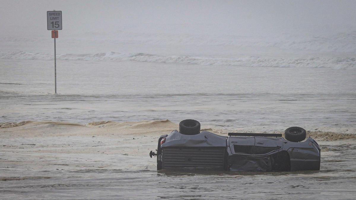High swells on the ocean combined with seasonal high tides leading to water rescues Dec. 28, 2023 at Oceano Dunes SVRA. This truck periodically tumbled in Arroyo Grande Creek due to storm surge, occupants were rescued earlier.