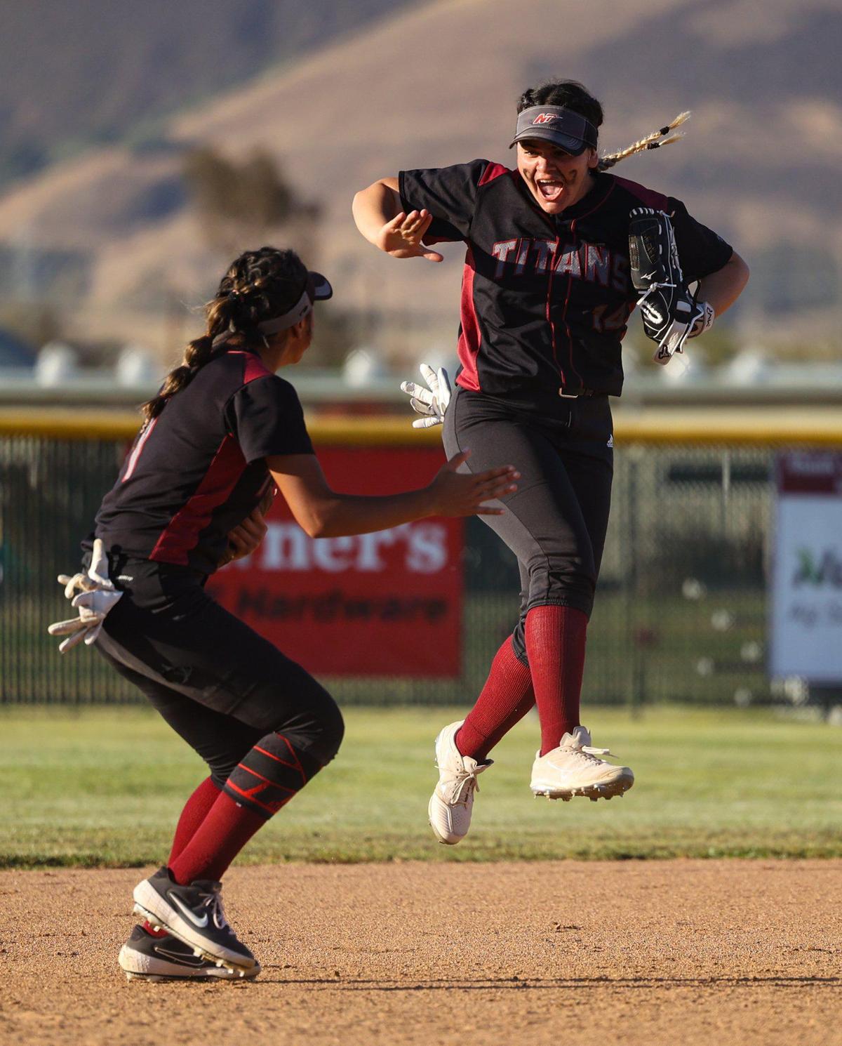 Tania Conde jumps in celebration after making a catch in center field as Melania Ruelas joins in. After trailing all game, the Nipomo Titans beat the Fallbrook Warriors 9-8 in a walk-off win in the first round of the Division V CIF Southern California Softball Championships.