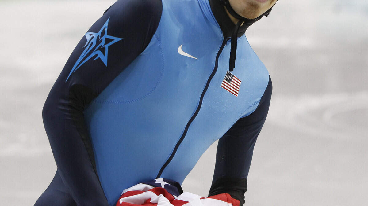 Apolo Anton Ohno of the U.S. reacts after winning bronze in the men's 1,000-meter short track speedskating race. (George Bridges / MCT)