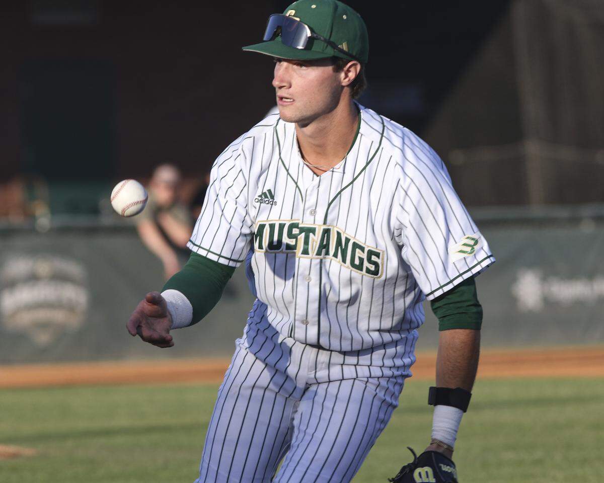 Jake Downing flips the ball to the pitcher Griffin Naess for an out at first base. Cal Poly lost 6-0 to UCSB on April 2, 2026.