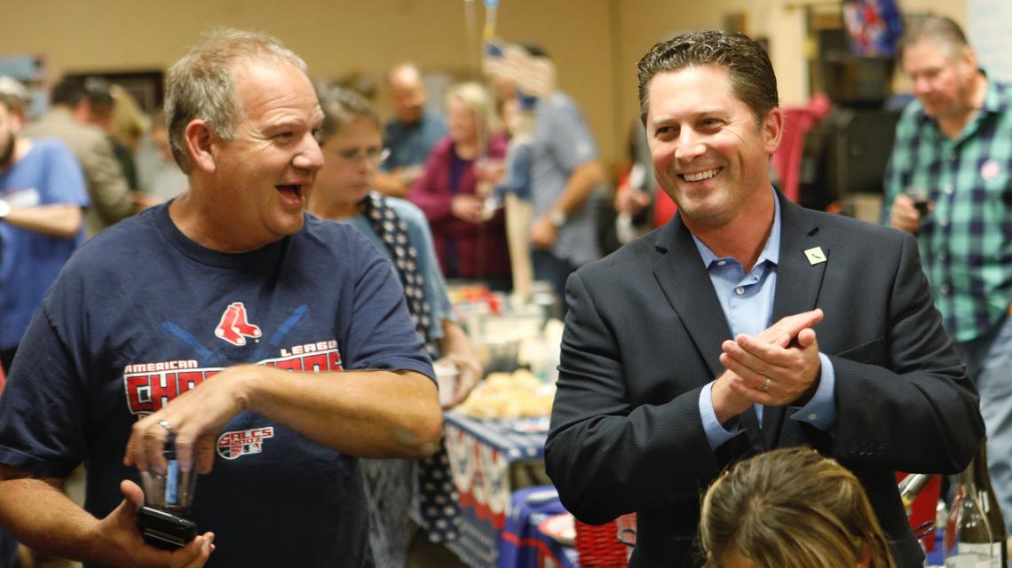 Supporter Geoff Auslen, left, cheers with Assemblyman Jordan Cunningham at Republican Party Headquarters in Atascadero as the first election results in the 2018 assembly race were revealed. Cunningham retained his office that year by defeating challenger Bill Ostrander.
