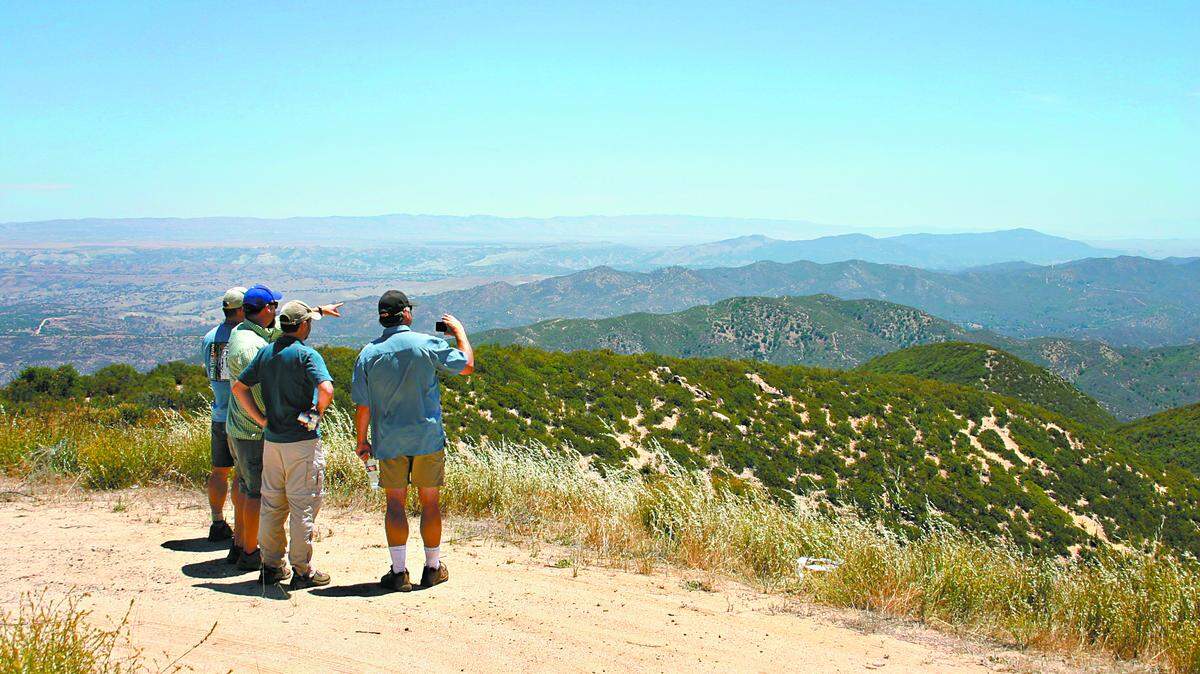 Wilderness advocates (left to right) Warren Alford, Matt Sayles, Jeff Kuyper and Christopher Danch enjoy the view from atop Black Mountain of backcountry land.