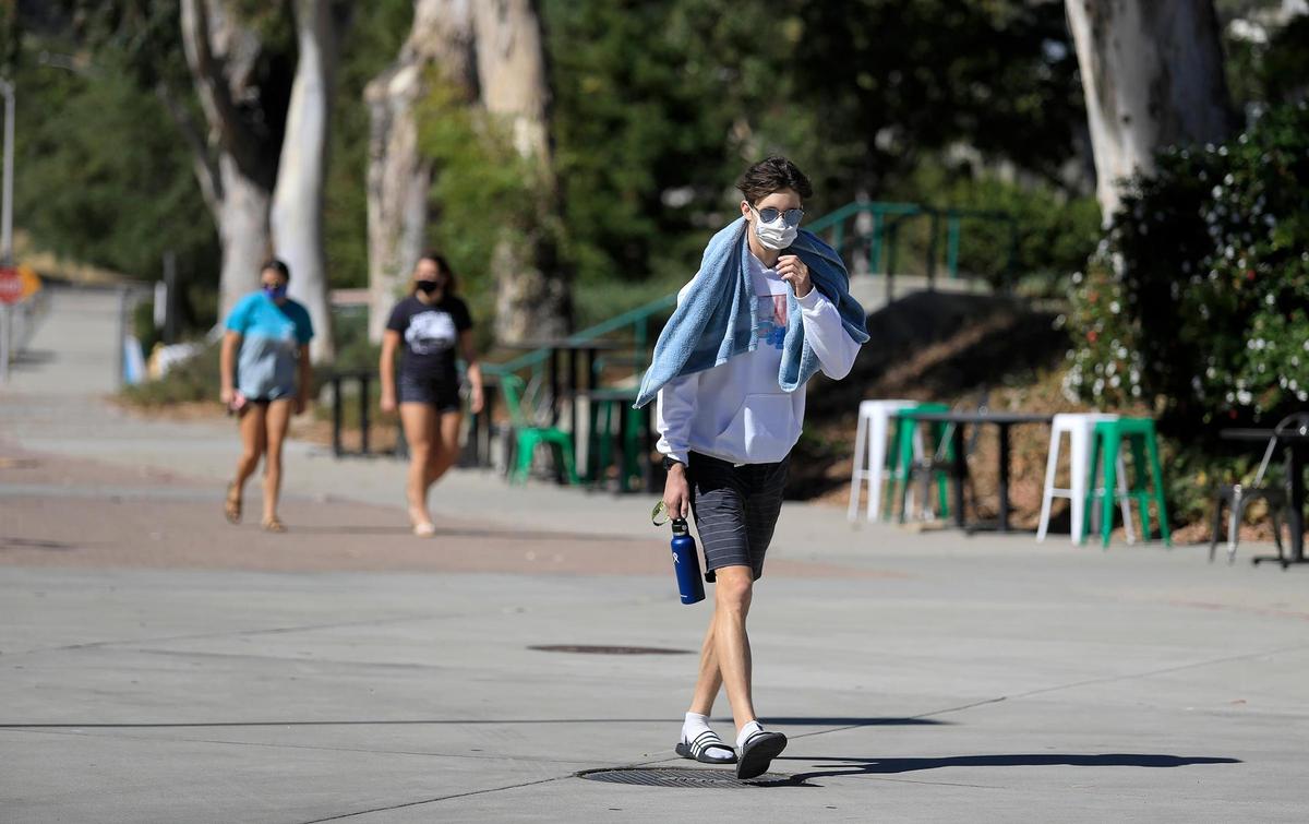 A Cal Poly student walks on campus in San Luis Obispo, California, in September 2020.