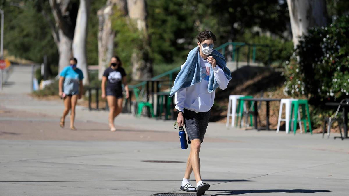 A Cal Poly student walks on campus in San Luis Obispo, California, in September 2020.