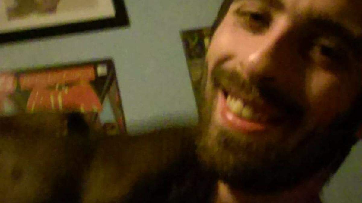 Justin Bice, 29, poses for a picture with his family’s dog, Coda. The Paso Robles man was allegedly shot in the head by Carlos Luis Chavez, who was arrested on suspicion of attempted murder.