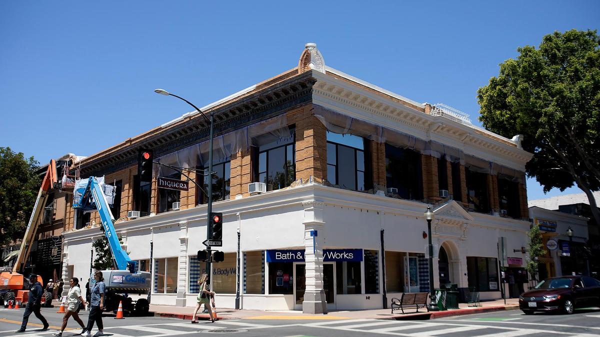 San Luis Obispo’s historic Warden Building on Higuera Street — home to Bath & Body Works — is being painted white, much to the concern for some residents.