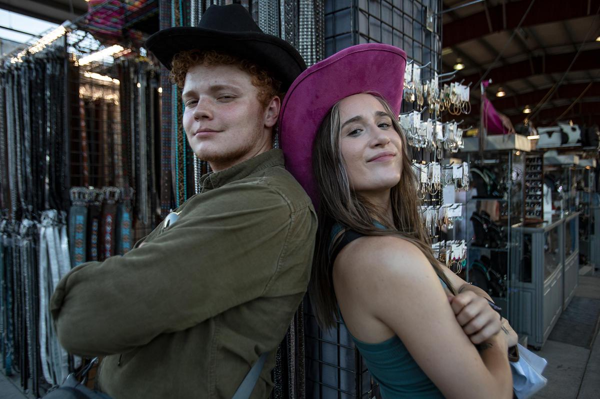 The Mid-State Fair main Carnival rides are one of the best attraction for fair goers. Tribune reporters John Lynch and Chloe Jones try on cowboy hats.
