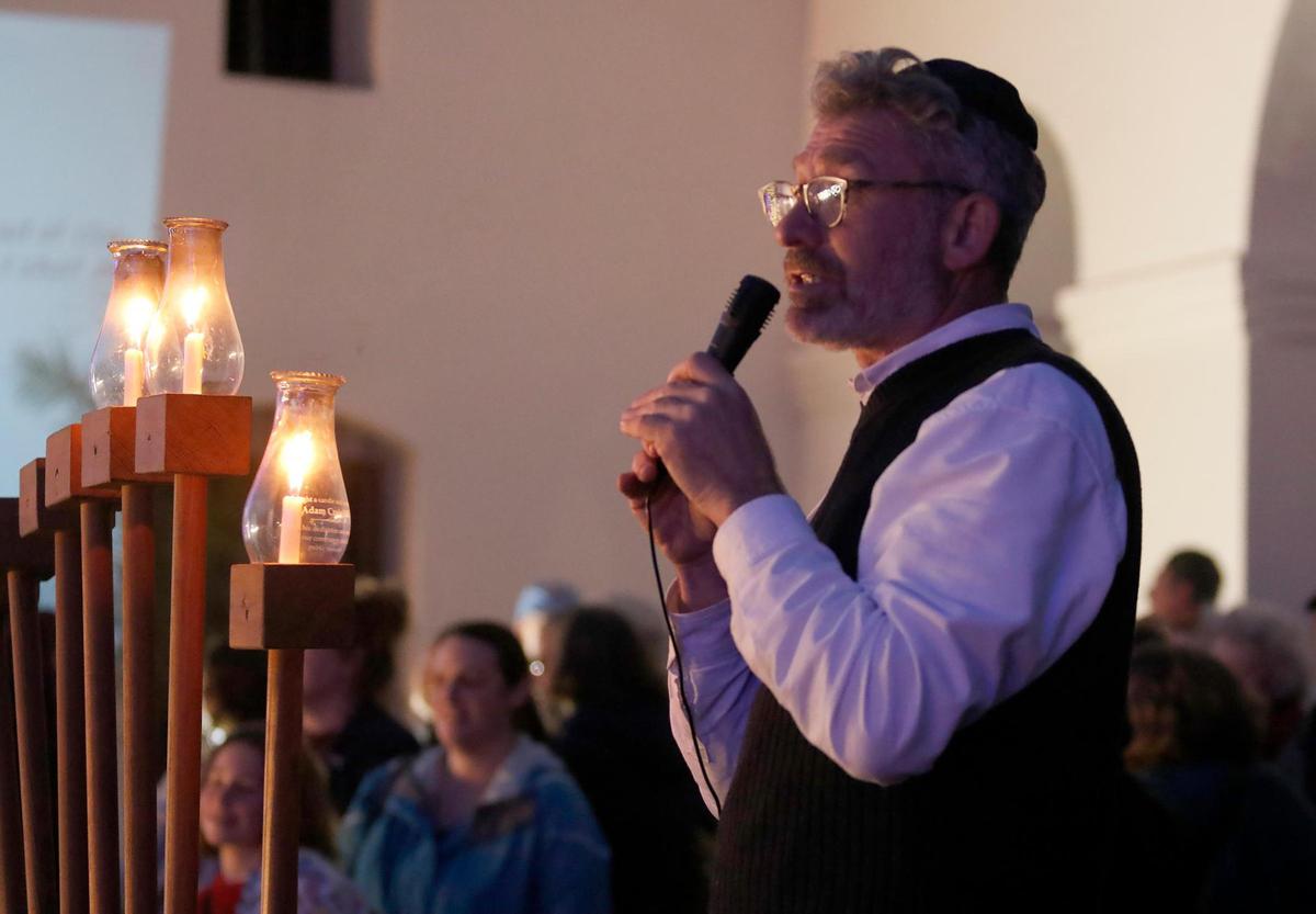 San Luis Obispo’s Jewish community gathered with friends and neighbors on Dec. 26, 2024, for the city’s annual Hanukkah celebration downtown. Rabbi Micah Hyman conducts the lighting ceremony.