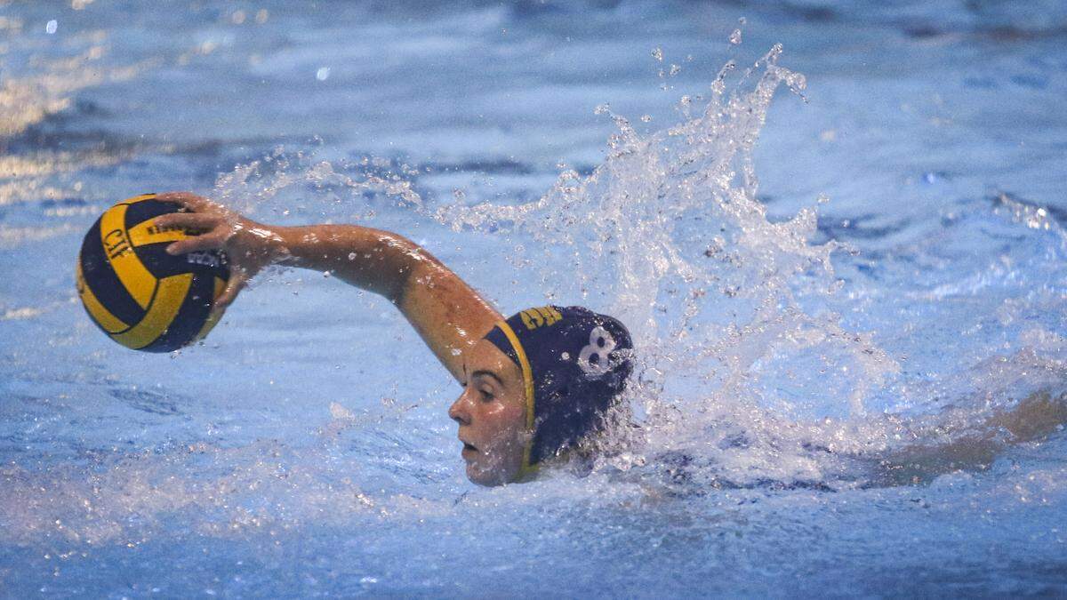 Natalie Whitfield swims in an attack on the goal. Arroyo Grande girls beat Clovis East 20-5 in a playoff water polo match on Nov. 5, 2025.