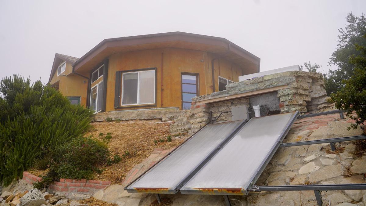 San Luis Obispo County homeowners Cam and Janeen Schiff spent 15 years turning a 40-acre mountaintop property between Cayucos and Atascadero into an ecologically-friendly home, pictured Wednesday, Sept. 25, 2024. Built primarily from reused materials, the property features several environmentally-friendly features including a composting toilet, rainwater reclamation system and a solar-powered hot tub.