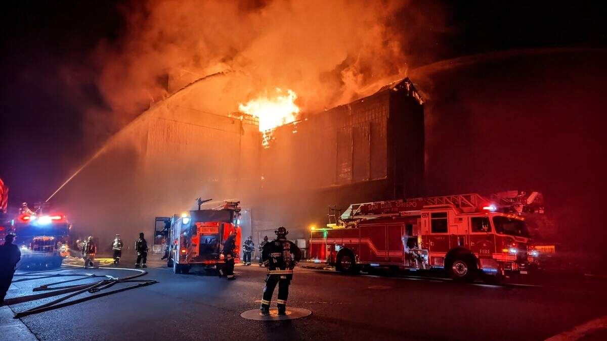 Templeton Fire Capt. Brandon Wall monitors firefighting operations during the Feed & Grain fire on July 4, 2025. Firefighters from Templeton and neighboring agencies worked through the night to keep the blaze from spreading to nearby businesses, homes and vegetation.